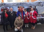 Mayor of Skegness Coun Tony Tye (second right) at the Christmas market in Skegness.
