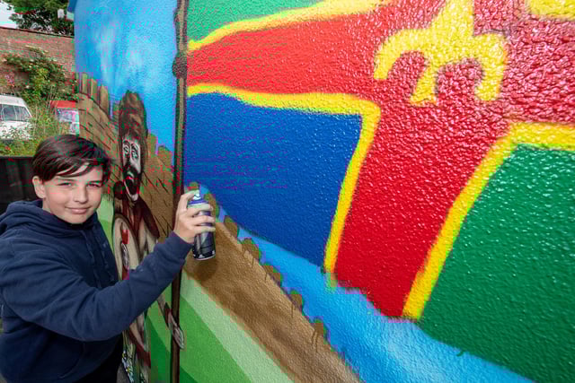 Harley Swain, age 13, making his mark.