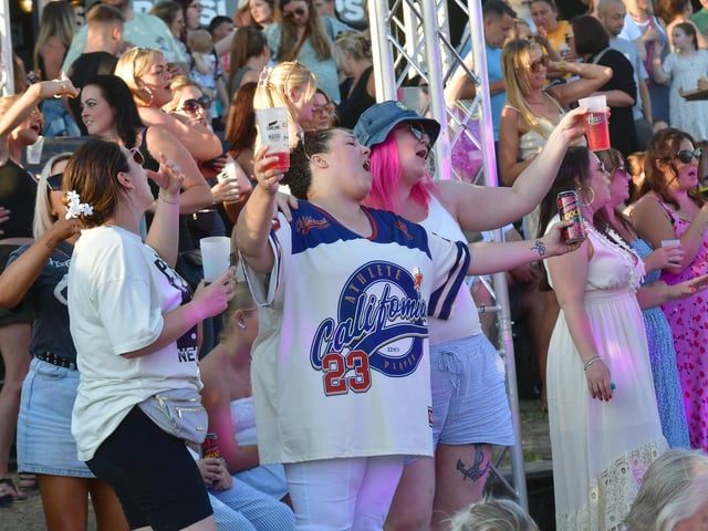 Singing along.