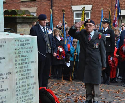 RBL stalwart Les Tranter honouring the fallen at last year's Remembrance event, with Parade Sergeant and Branch Chairman Mick Kenning looking on