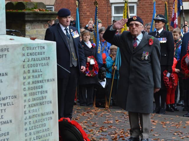 RBL stalwart Les Tranter honouring the fallen at last year's Remembrance event, with Parade Sergeant and Branch Chairman Mick Kenning looking on