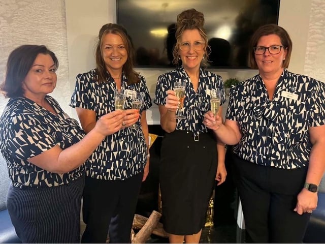 Staff at Thimbleby Court toasting their success.