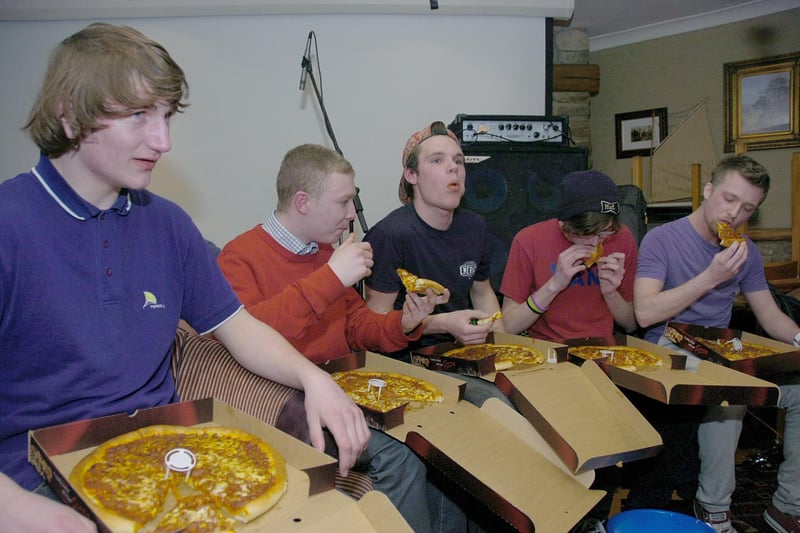 A group of five taking on possibly the world's hottest pizza, courtesy of The Little Italy Pizza Company, at a charity fundraiser at Sleaford's Barge and Bottle. A free pizza was available for anyone who completed the challenge.