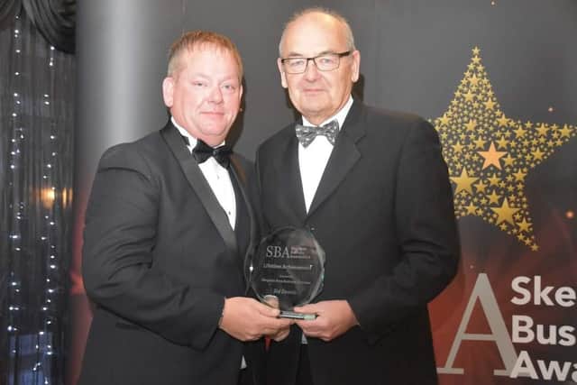 The Lifetime Achievement award was presented  posthumously to Sid Dennis. Chris Baron Vice Chair of Skegness Area Business Chamber (right), is pictured presenting the award to Nick Dennis, Sid's son. Photo: Barry Robinson.