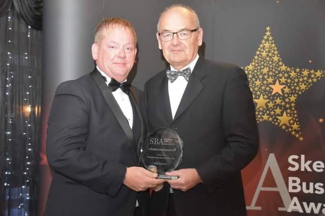 The Lifetime Achievement award was presented posthumously to Sid Dennis. Chris Baron Vice Chair of Skegness Area Business Chamber (right), is pictured presenting the award to Nick Dennis, Sid's son. Photo: Barry Robinson.