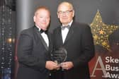 The Lifetime Achievement award was presented  posthumously to Sid Dennis. Chris Baron Vice Chair of Skegness Area Business Chamber (right), is pictured presenting the award to Nick Dennis, Sid's son. Photo: Barry Robinson.