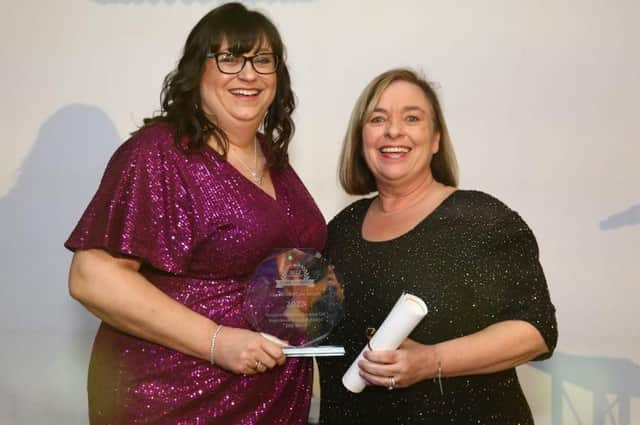 Mandy Jackson (right), CEO of Tanglewood Care Services Ltd, Boston, presenting Jilly Hunt, Manager at Ashdene Care Home in Sleaford, with her award at The Lincolnshire Care Awards 2023.