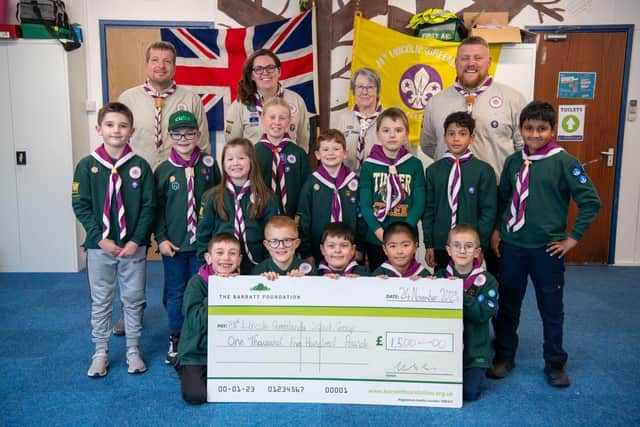 28th Lincoln Greenlands Scout Group with a cheque for £1,500