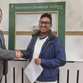 Skegness Grammar School Executive Headmaster  Jude Hunton congratulates Yusuf Ahmed.