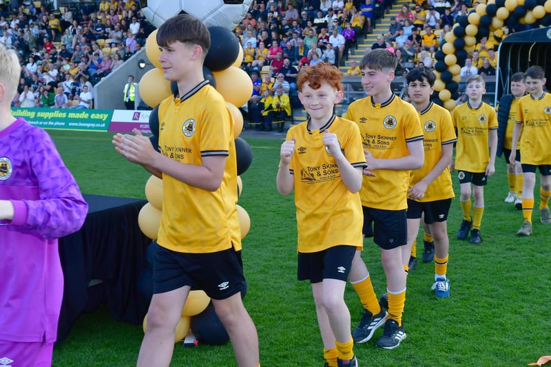 Junior teams cheered onto the pitch.