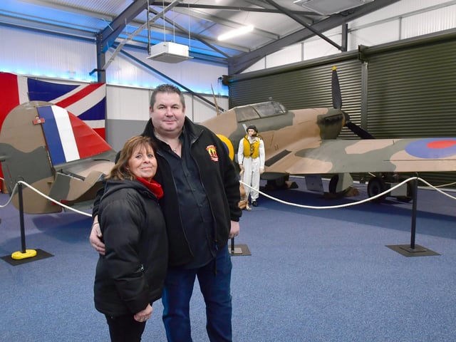 Paul and Linda Britchford in front of the museum's Hawker Hurricane exhibit.