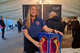 Katy Jarvis-Morgan, STEP's site stakeholder manager, with a model of the fusion reactor at a consultation event in Gainsborough
