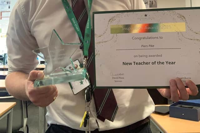 Barnes Wallis Academy teacher Piers Pike, from Fulstow, with his new teacher award.