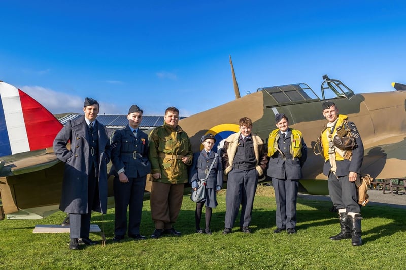 Supporters and members of the young museum group alongside the huge film prop. Photo by Jason Dawson