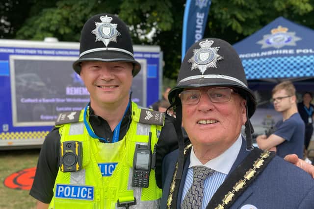 Hello, hello... Mayor of Skegness Coun Tony Tye having a chat to the local police.