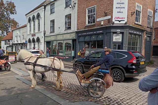 Arriving in Horncastle on a previous carriage ride. Didi's Riders and Drivers will be arriving in the Market Place at 12noon on Sunday for a harvest festival to collect donations for the Community Food Larder. Photo supplied