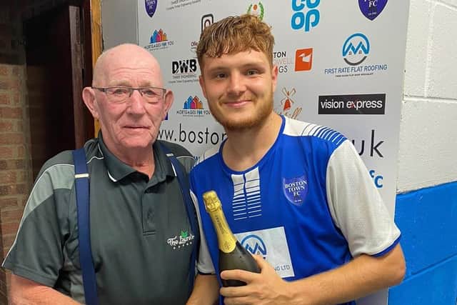 Liam Adams receives his man-of-the-match award.