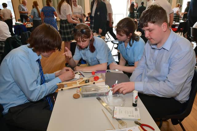 St George's Academy students problem solving at the Rotary Technology Tournament.