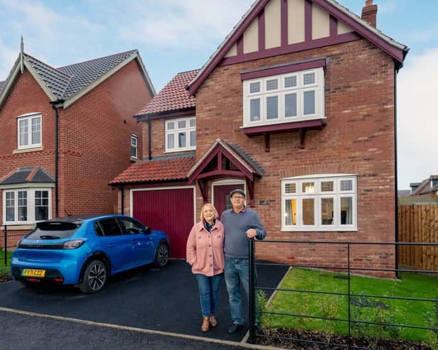 Mark Williams and his nursery worker wife Julie outside their dream home in Comingsby.