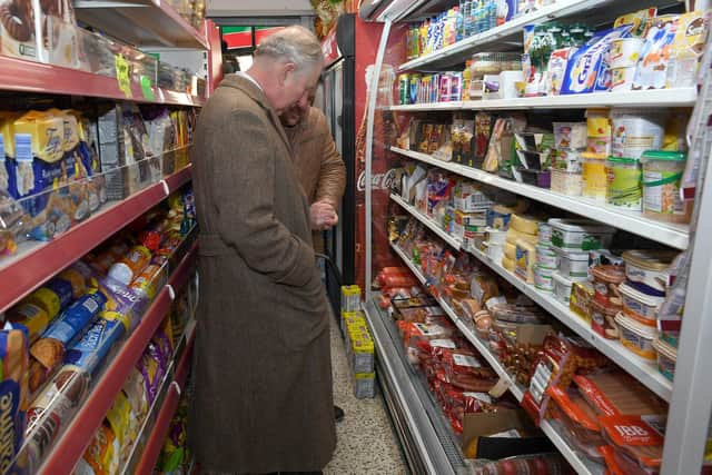 The future King inspects the international food on offer at the Boston convenience store.