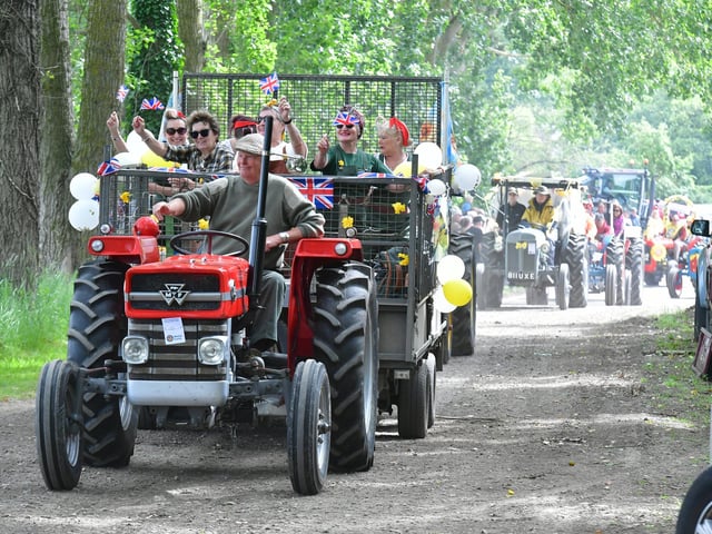 Flying the flag is this patriotic tractor leading the way out of Ludborough.