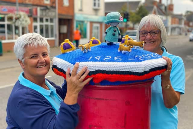 Sutton on Sea's "Crafty Knitters" Kim Hoey and Jessie Smith with a postbox topper to commemorate Queen Elizabeth II. Photo: Chris Frear