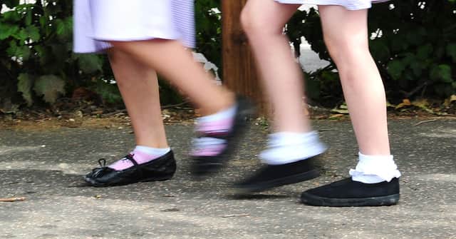 File photo date 15/07/14 of a generic stock photo of school girls walking to school. Many children are not ready to start school when they first enter a classroom, a poll of headteachers suggests.