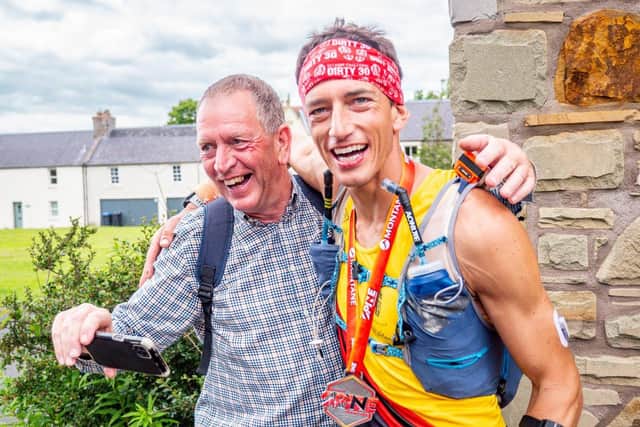 Chris Cope, with dad Pete, at the end of the race.
