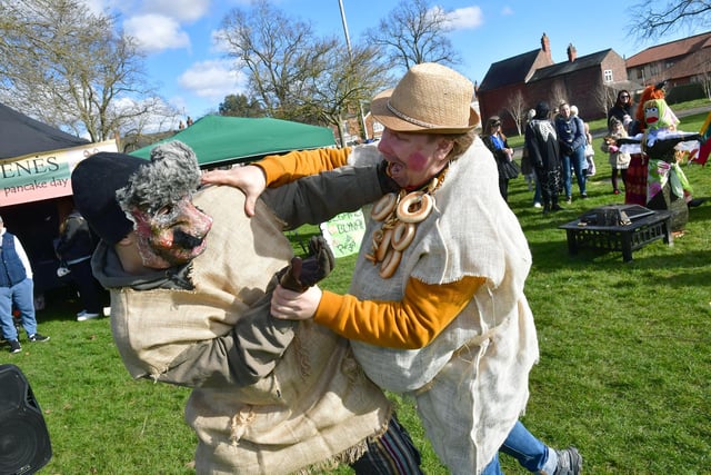 Two characters representing spring and winter engage in battle.