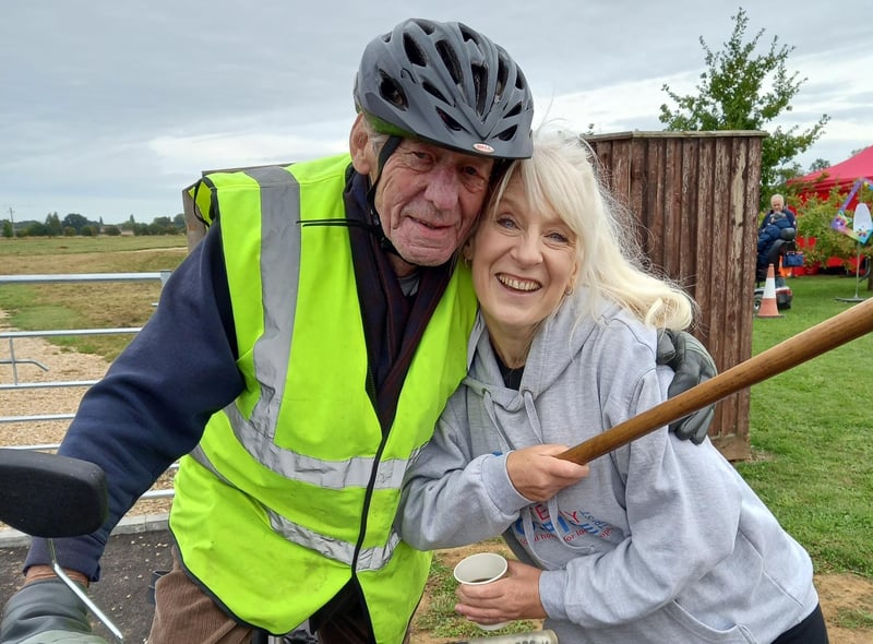 One of the riders at the event gets a supportive cuddle from the hospice’s chief executive Bridget Macpherson.