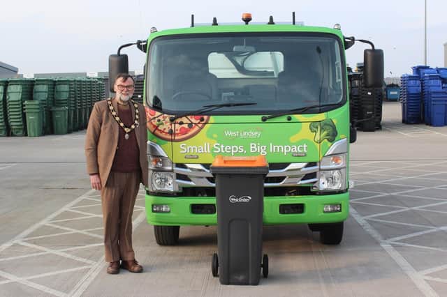 Coun Stephen Bunny with one of the new food waste bins. Photo: WLDC