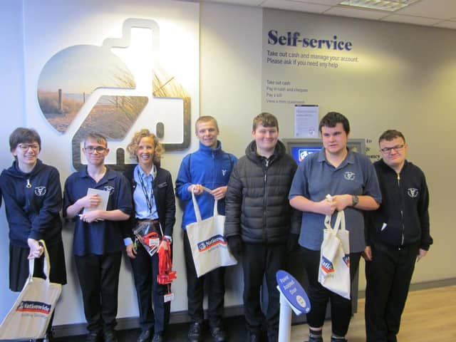 Eresby students at self service machine at Nationeide in Skegness.