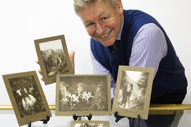 Auctioneer James Laverack with the Cottingley Fairy photographs.