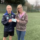 Sleaford Snails donate to New Life Community Larder food bank. The Snails chairman Steve Spick and Lina from the food bank.