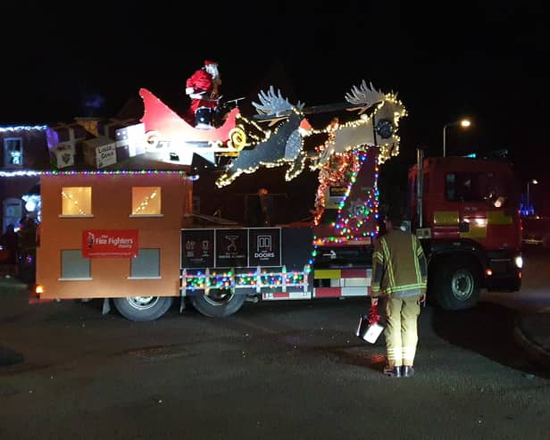 Father Christmas sleighs 'em on his fantastic charity musical tour of Sleaford with the fire service.