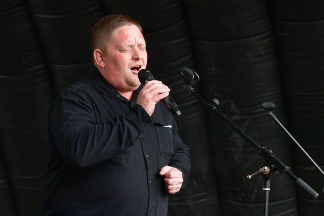 Singer Bryan Richardson performs at the Jubilee Party in the Market Place event in Boston.