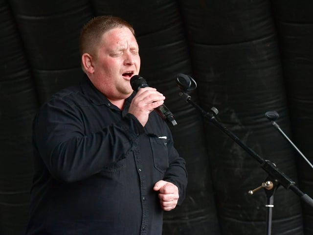 Singer Bryan Richardson performs at the Jubilee Party in the Market Place event in Boston.