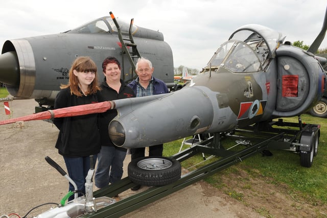 A scene from the annual Friends of Metheringham Airfield Open Weekend of 2014. Pictured (from left) Jessica Robertson, 14, and Penny Brooks, of Ruskington, and Jim Brooks, of Dorrington, with a Harrier GR3 cockpit.