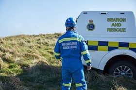 A teenager was rescued when the hole he was digging in sand  collapsed.