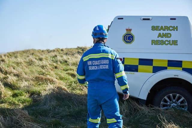 A teenager was rescued when the hole he was digging in sand collapsed.