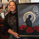 Samantha and her finished painting.