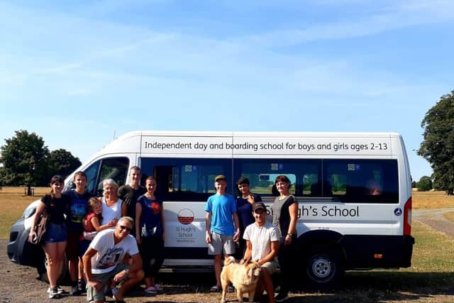 The refugees and team on their borrowed St Hugh's bus.