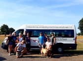 The refugees and team on their borrowed St Hugh's bus.