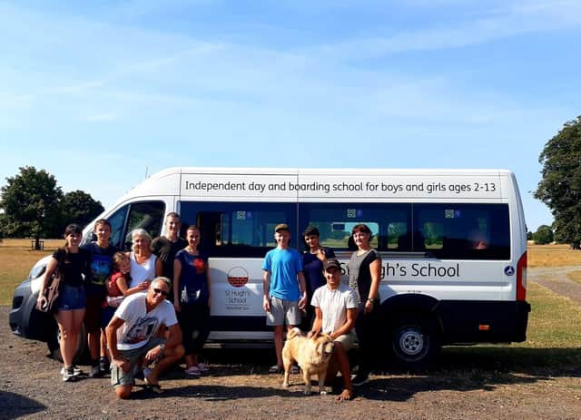 The refugees and team on their borrowed St Hugh's bus.