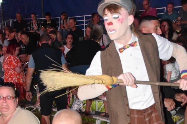 He's behind you - some clowning around with the audience.