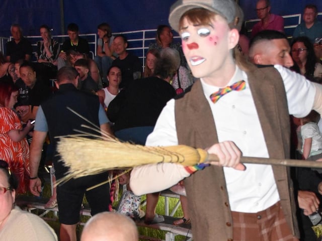 He's behind you - some clowning around with the audience.