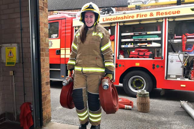 Willow Van Landeghem tries carries hoses at Horncastle Fire Station's open day.