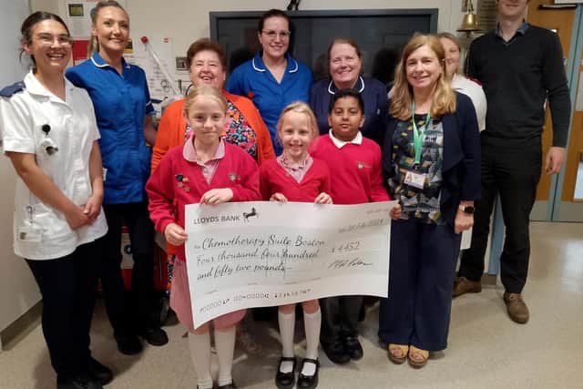 Hawthorn Tree School, Boston, making its donation to the chemotherapy suite at the town's Pilgrim Hospital.