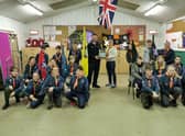 Dad Gavin presenting the defibrillator to Horbling and Billingborough Scout Troop.