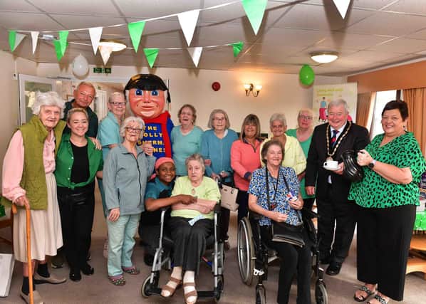 Mayor of Skegness Coun Pete Barry with the Jolly Fisherman and residents, staff  and guests of Aspen Lodge care home.